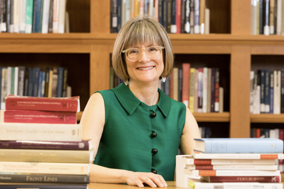 photo of woman with books
