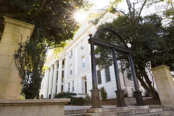 photo of arch, building in background, day